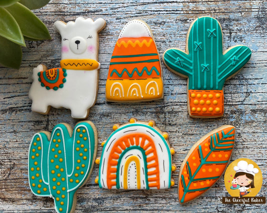 Finished Cookie cutter set  containing 1 llama cutter, 2 different cactus cookies, 1 boho rainbow, 1 feather and 1 boho mountain.