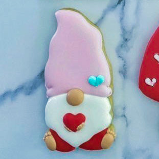 Valentine gnome holding heart cookie cutter