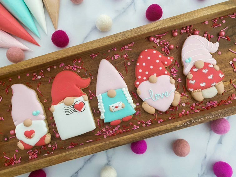 Valentine gnome holding heart cookie cutter